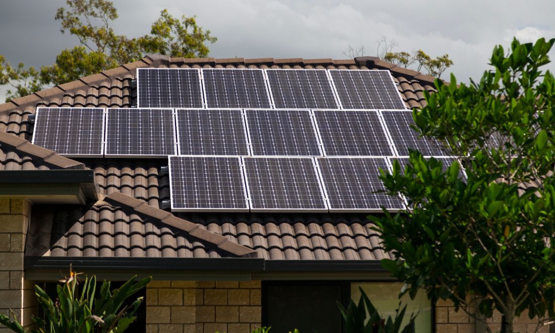 Rooftop solar panels on a tiled house roof